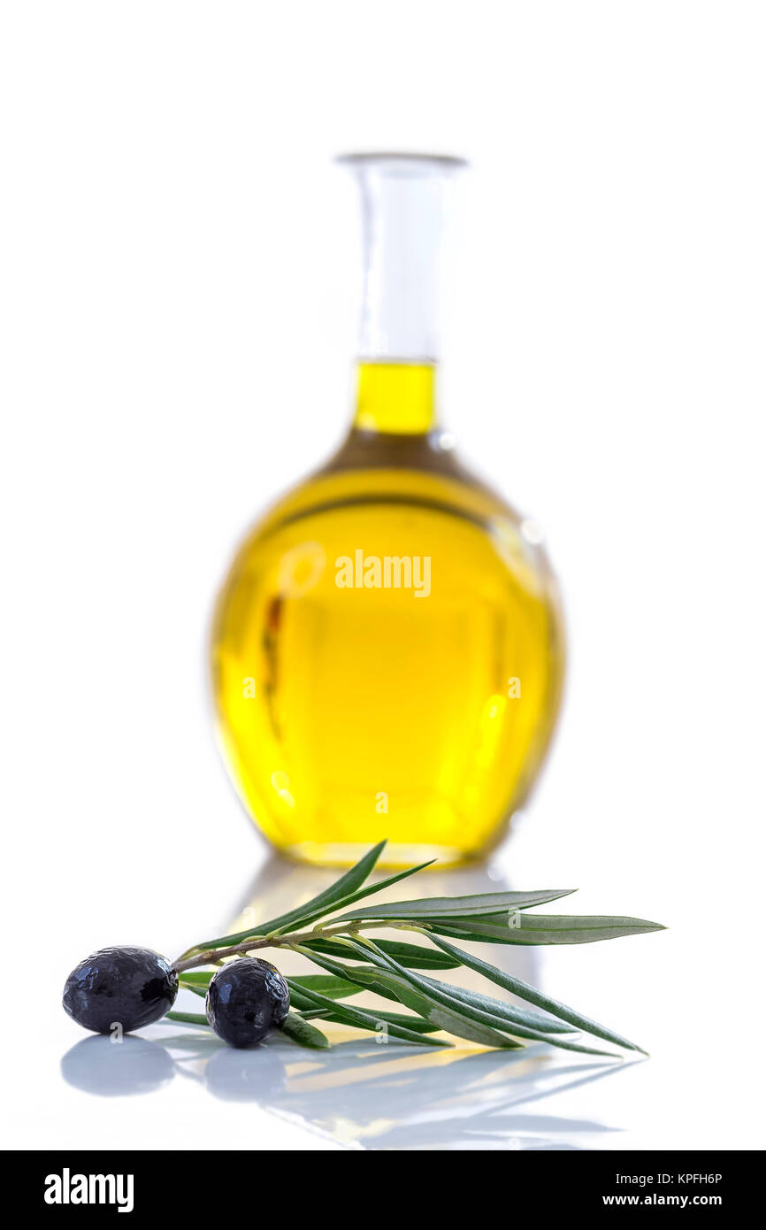 Corsican, traditional Olive oil glass bottle and olive branch on the ...