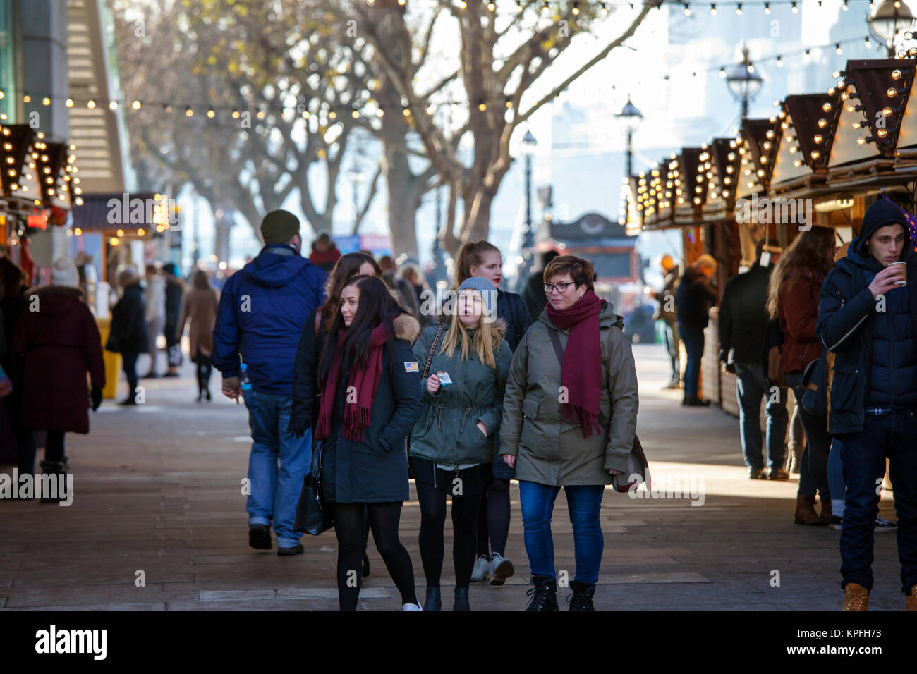 LONDON, UNITED KINGDOM - DECEMBER 12th, 2017: People enjoy Christmas Market set along the river Thames on Southbank in London, UK. Stock Photo