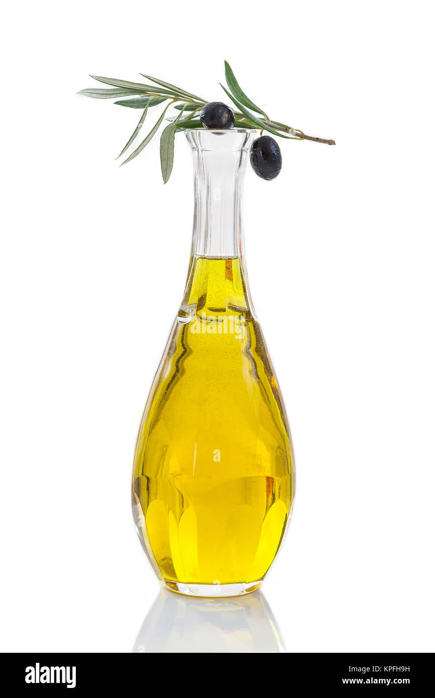 Corsican, traditional Olive oil glass bottle and olive branch on top on ...