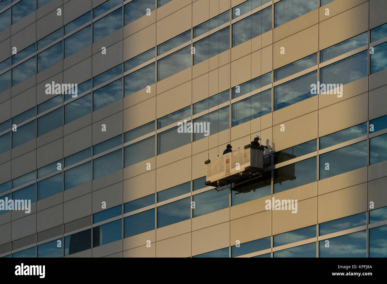 Window cleaners on the side of an office building in Odaiba Tokyo, Japan Stock Photo