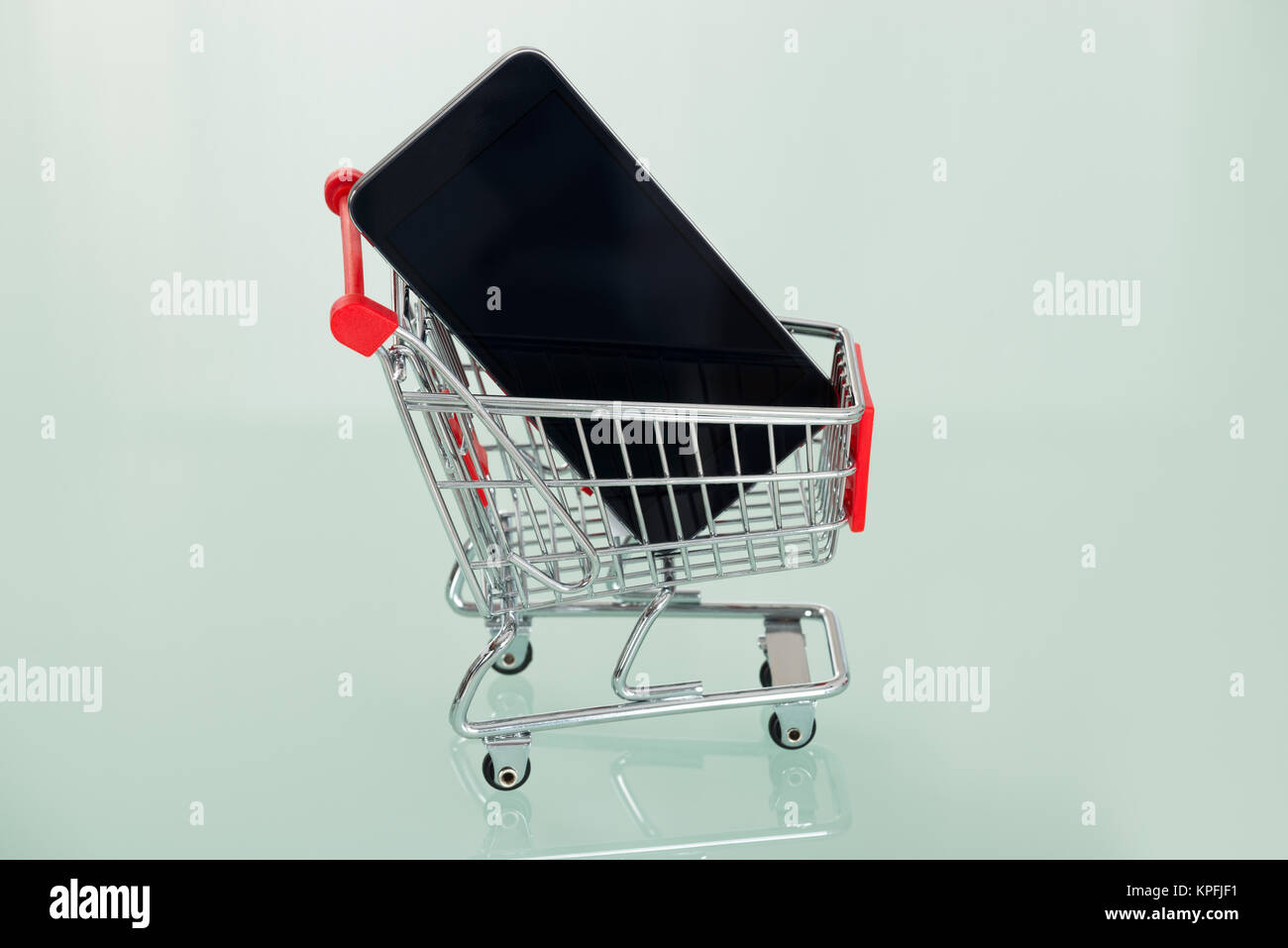 Cell Phone In Shopping Cart Stock Photo - Alamy