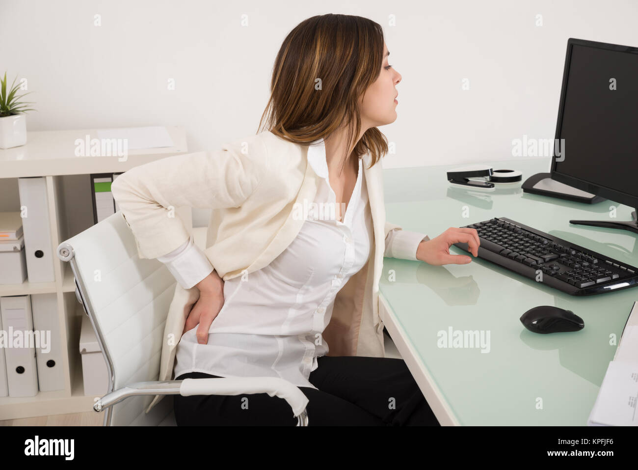 Woman Back Ache Office Desk High Resolution Stock Photography And