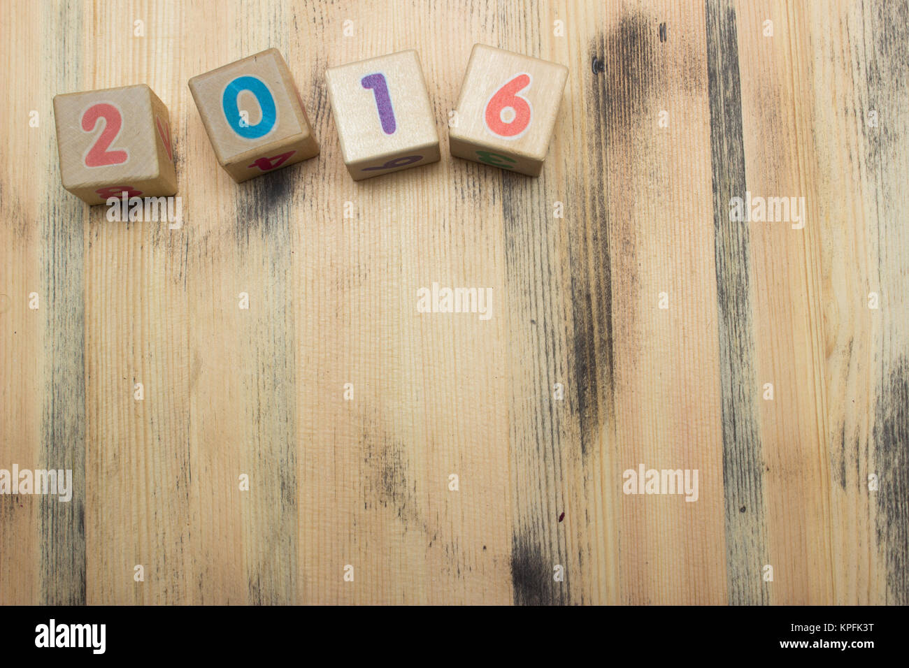 Cubes with numbers on wooden background Stock Photo