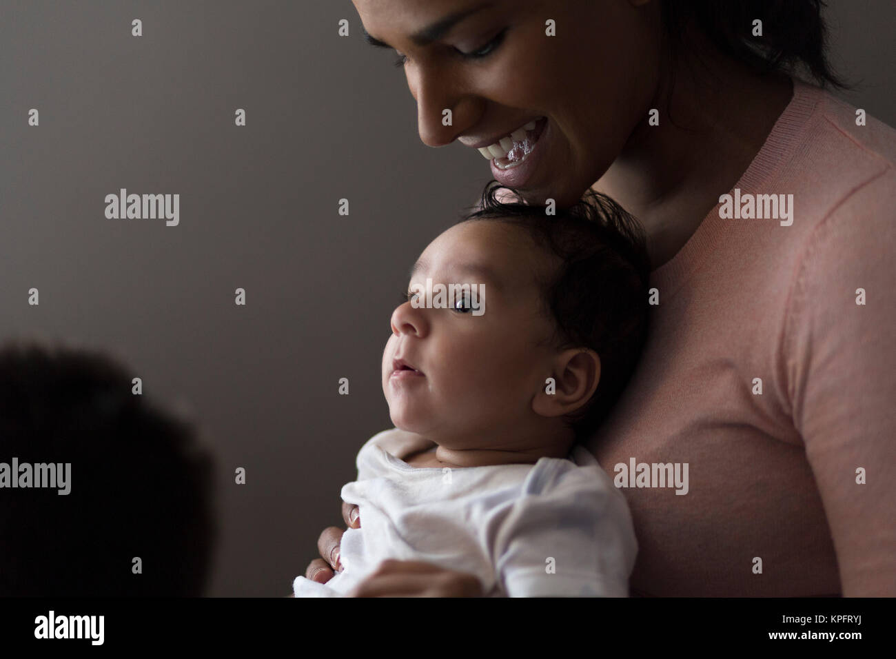 Cuddles with mummy Stock Photo