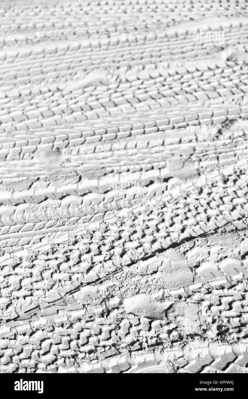 in the desert beach track of car and truck in the sand like abstract