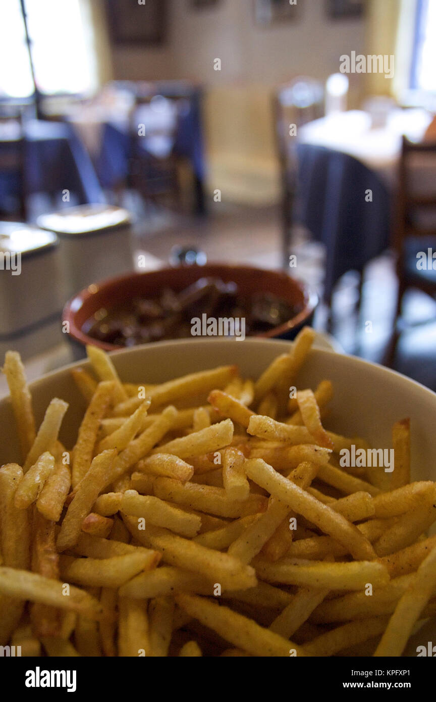 Europe, Belgium, Ghent. A bowl of fries served in a traditional Belgian restaurant Stock Photo