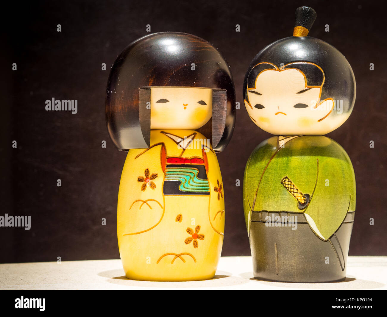 A wooden japanese figures of a Geisha and the Samurai Stock Photo Alamy