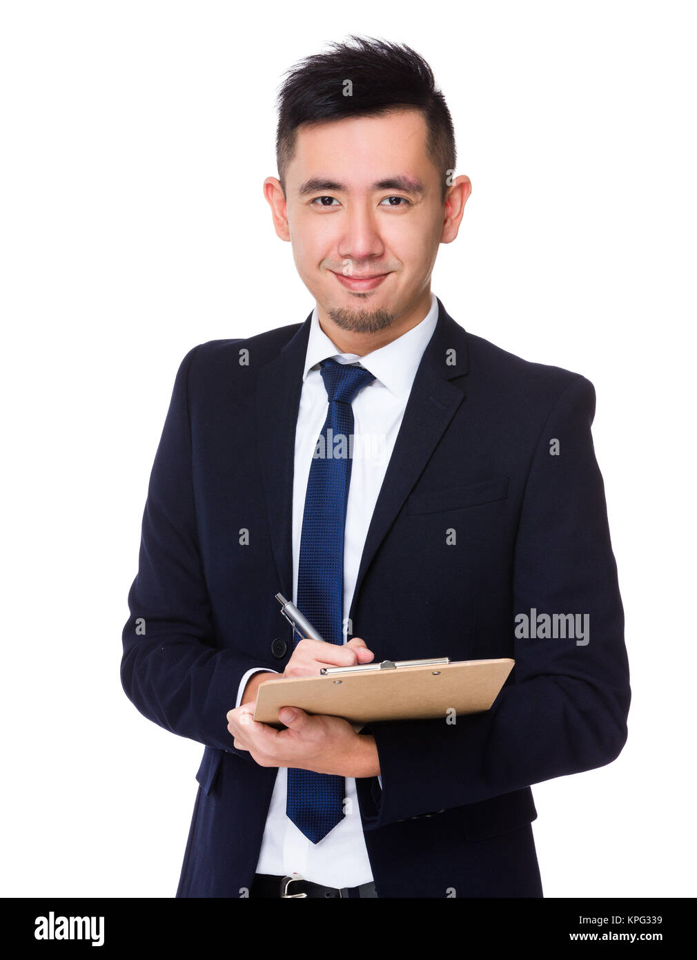 Asian businessman take note on clipboard Stock Photo - Alamy