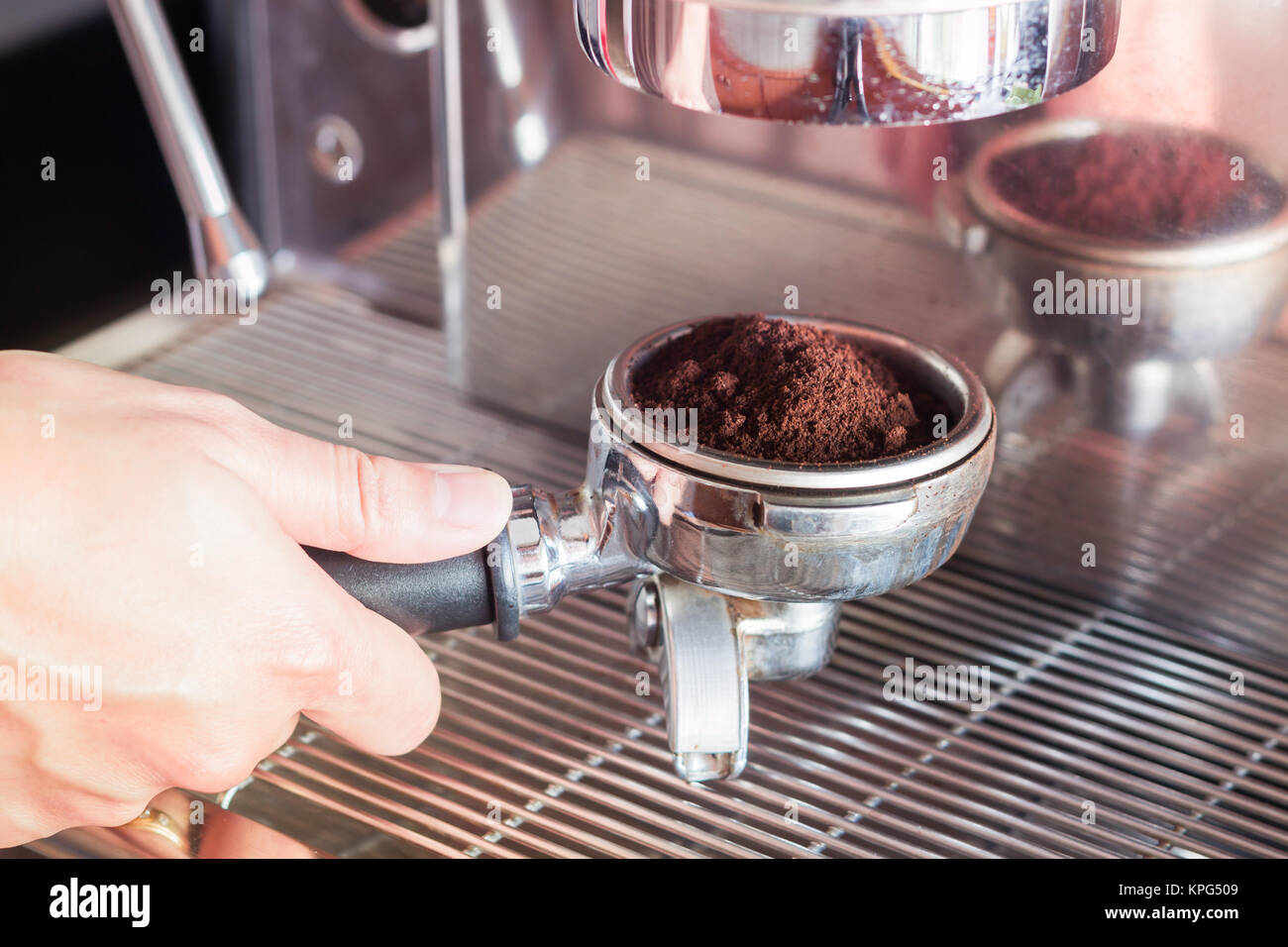 https://c8.alamy.com/comp/KPG509/womans-hand-holding-coffee-grind-in-group-with-vintage-style-KPG509.jpg