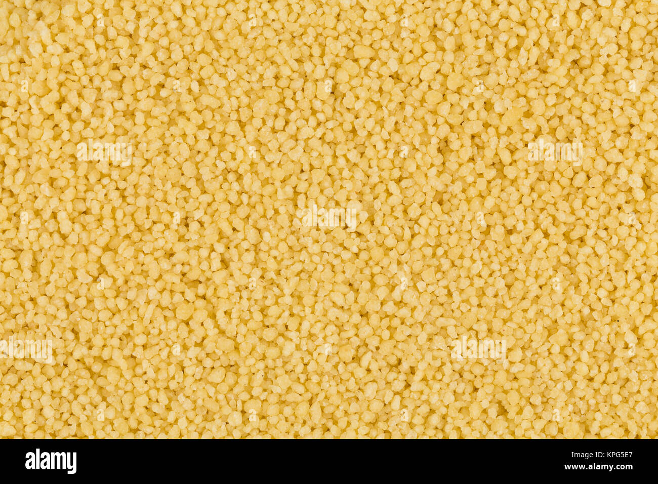 Couscous as background texture Stock Photo