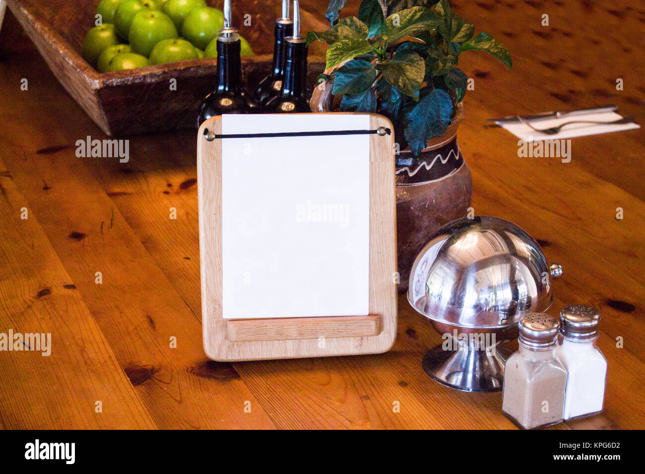 mock up menu frame on table in bar restaurant cafe with bartender Stock Photo