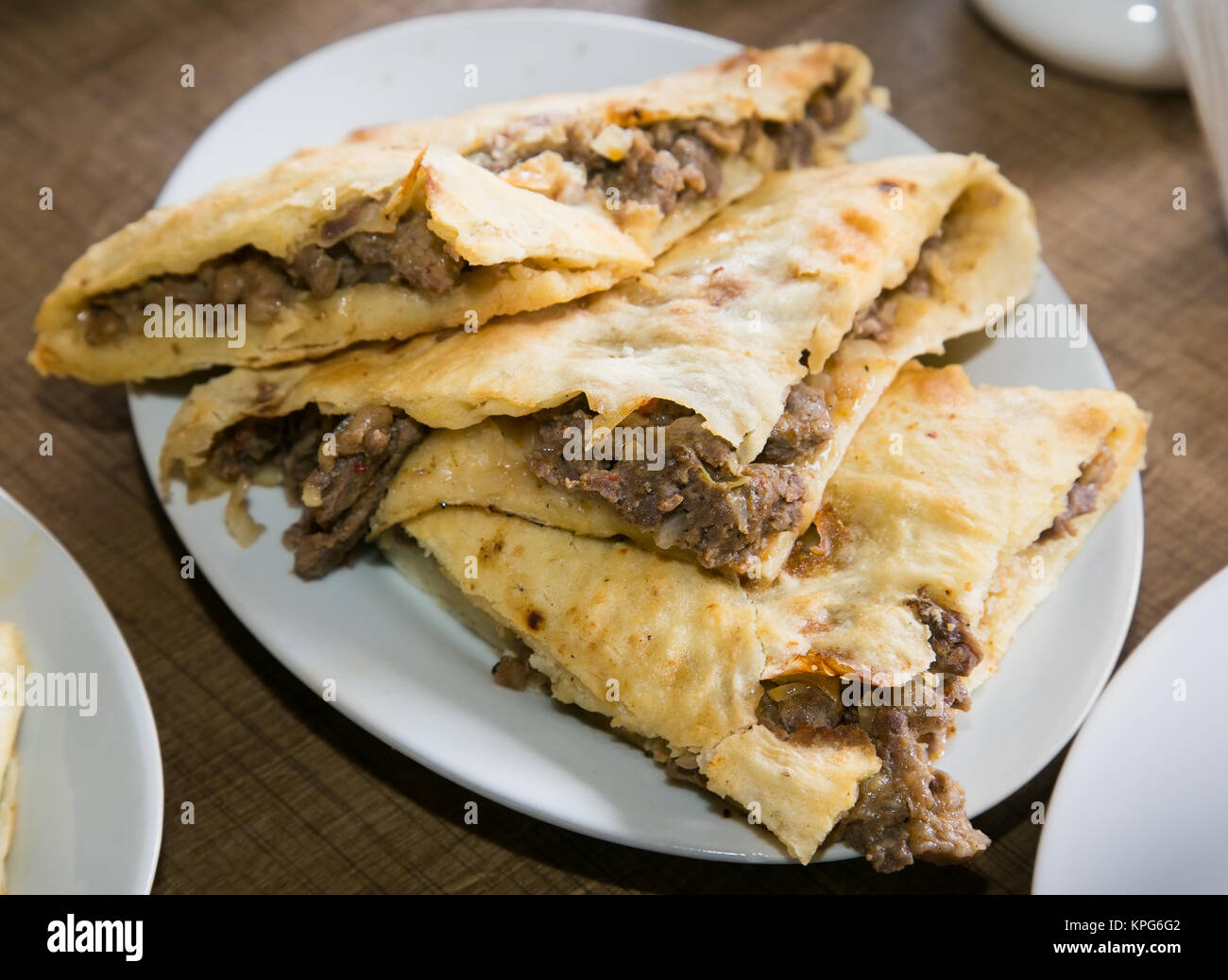 Traditional Georgian meat pie - khachapuri. The national cuisine of Georgia. Europe. Stock Photo