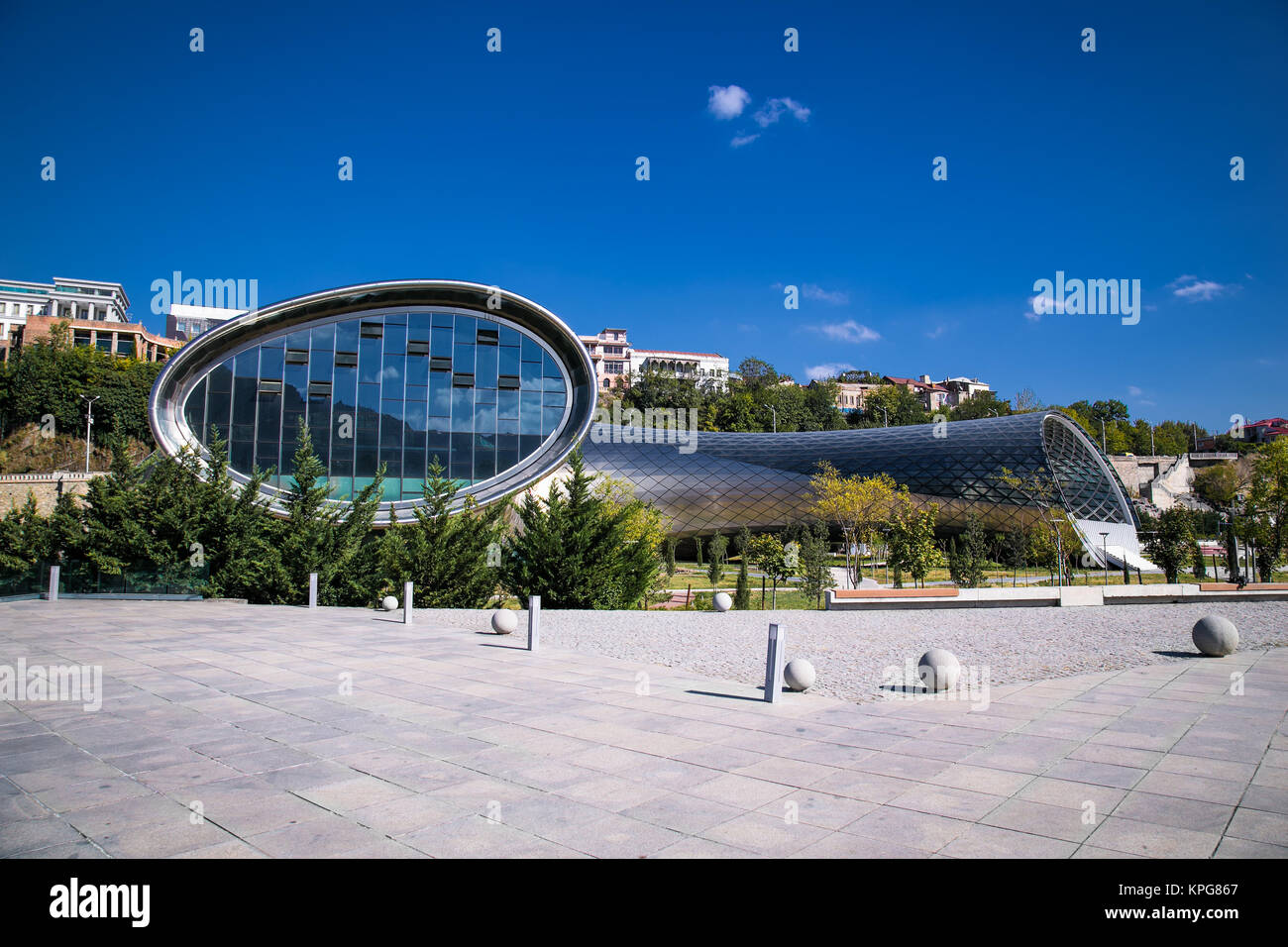 TBILISI, GEORGIA-OCT 2 2016: Modern design concert hall in Rike park and  Presidential Palace of Georgia behind, Tbilisi, Georgia, Oct 2, 2016. Europe Stock Photo