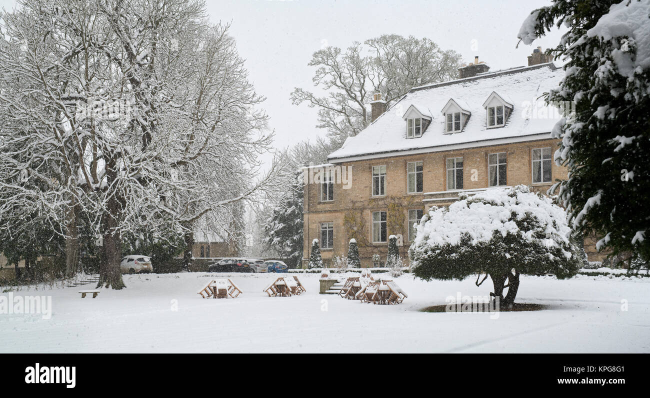 The Slaughters Manor House in Lower Slaughter village in the snow in December. Lower Slaughter, Cotswolds, Gloucestershire, England Stock Photo