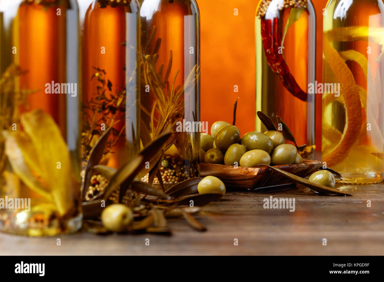 Green olives with leaves and bottles of olive oil Stock Photo - Alamy