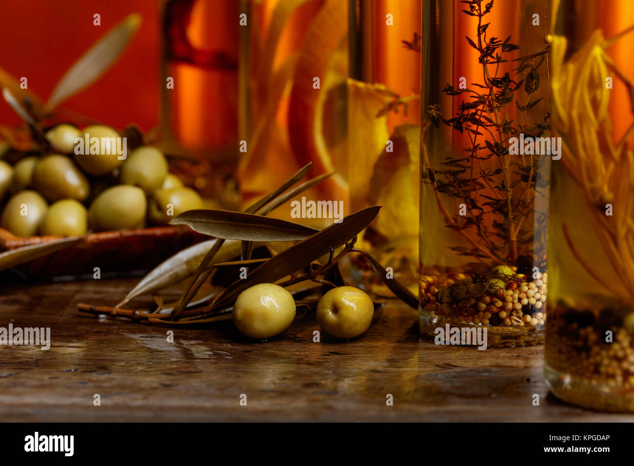Green olives with leaves and bottles of olive oil Stock Photo - Alamy