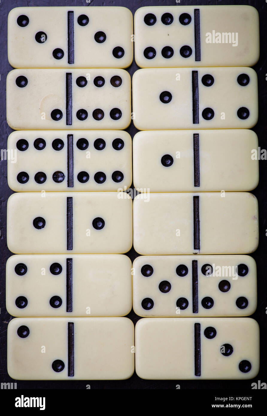 Black Dominoes game block on a colored background Stock Photo - Alamy