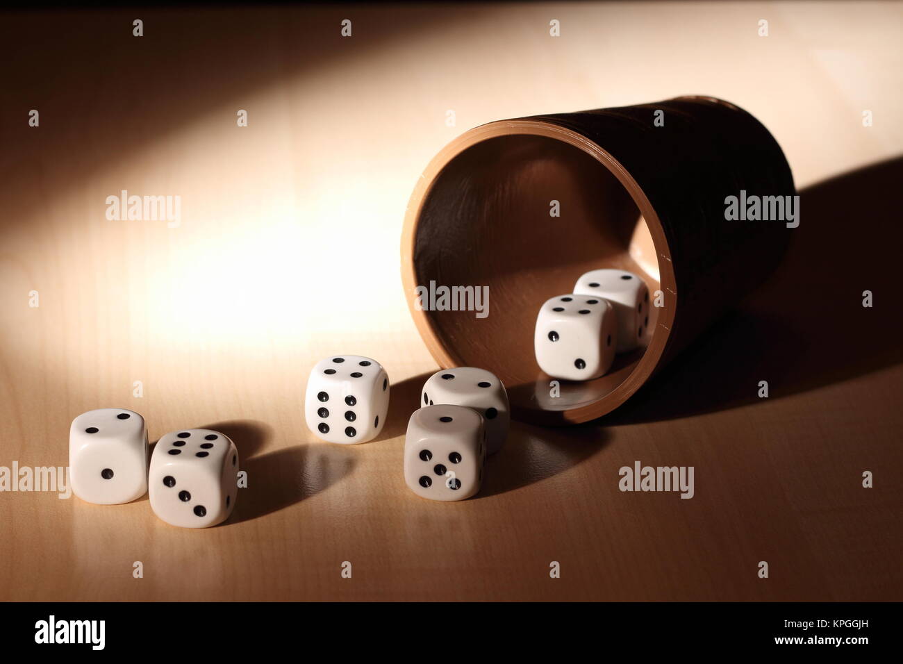 Dice cup cup cube game brown eyes toy hires stock photography and