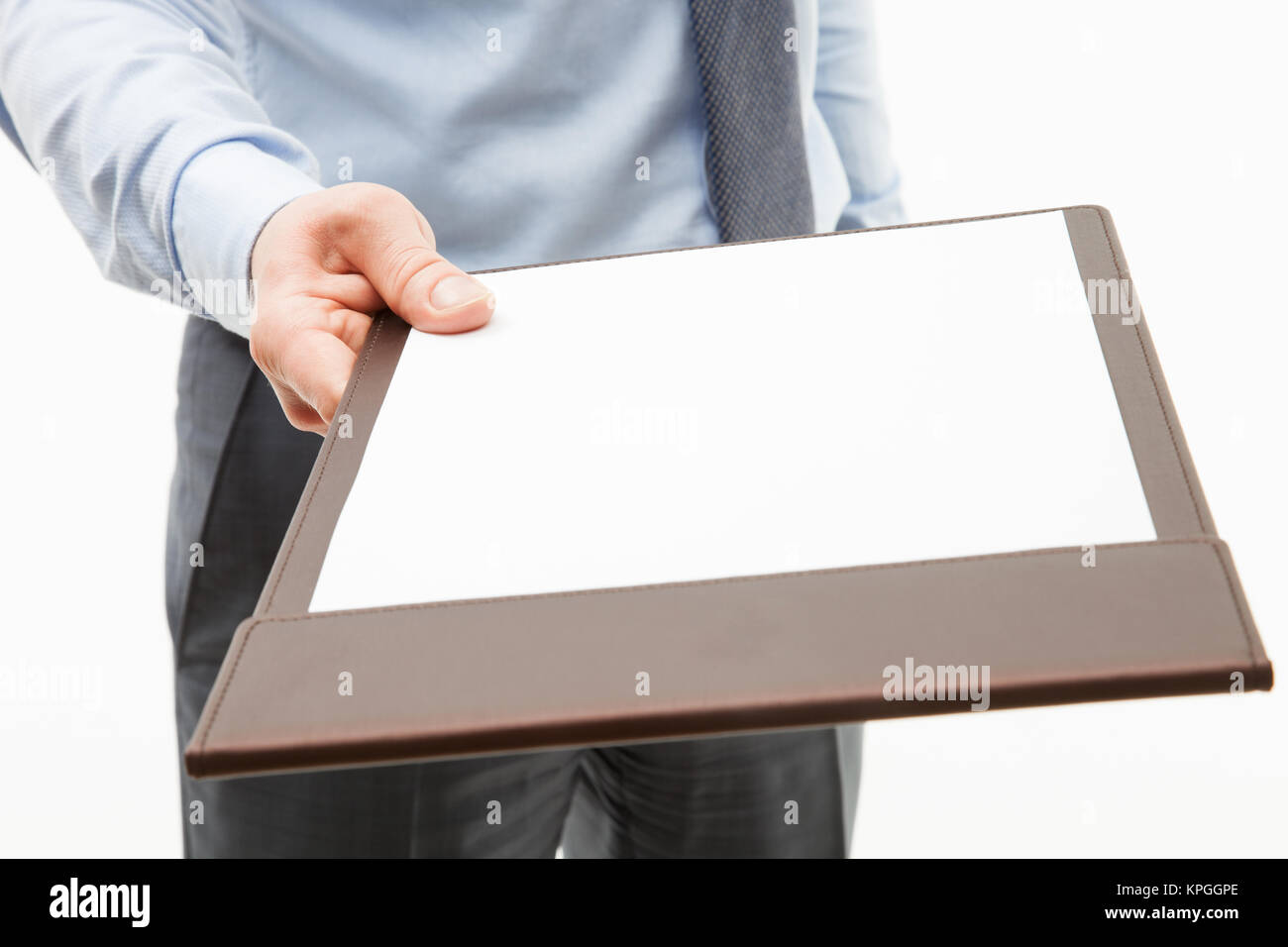 Businessman holding a clipboard with empty sheet of paper Stock Photo ...