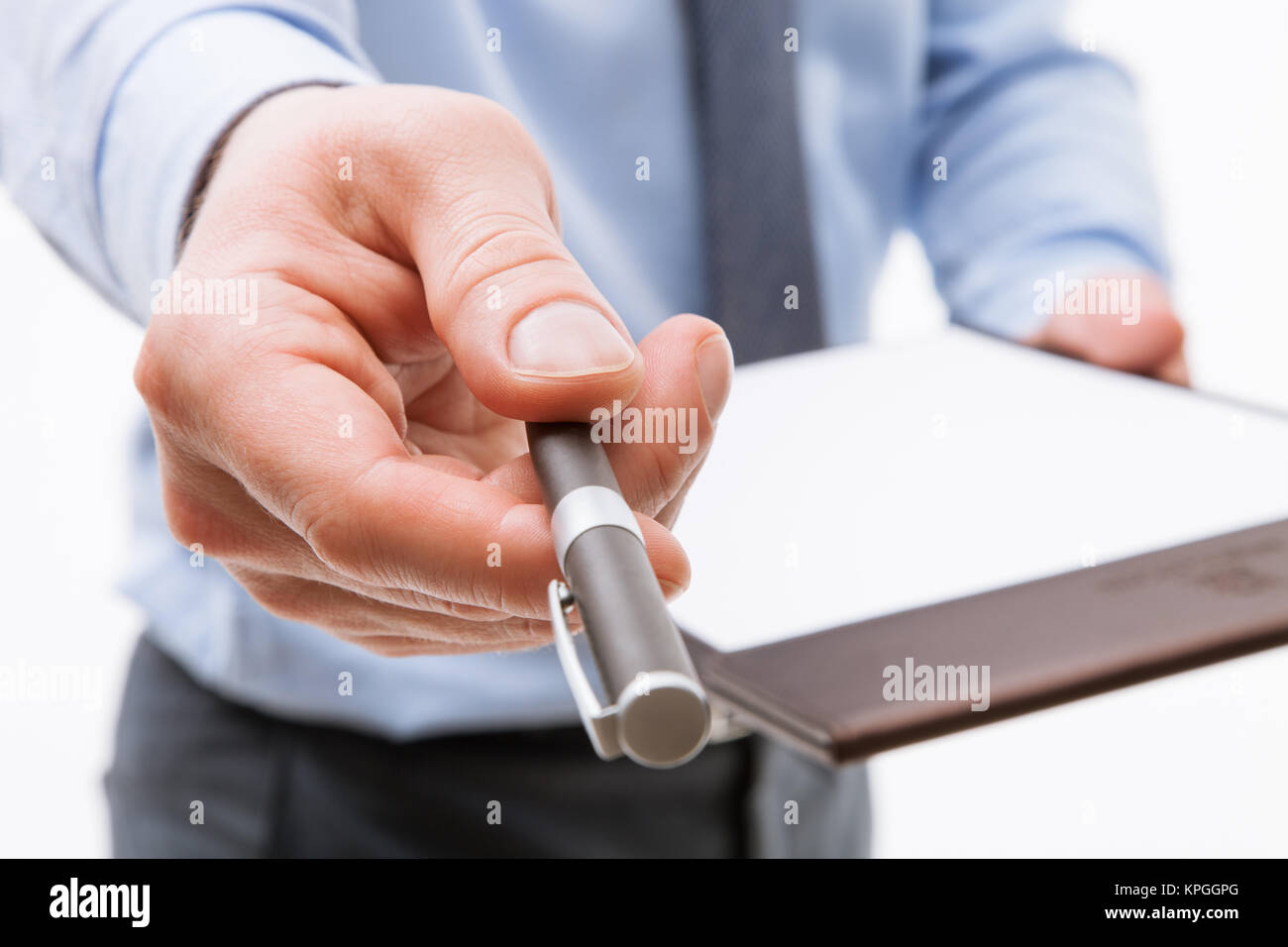 Businessman holding a clipboard with empty sheet of paper and proposing ...