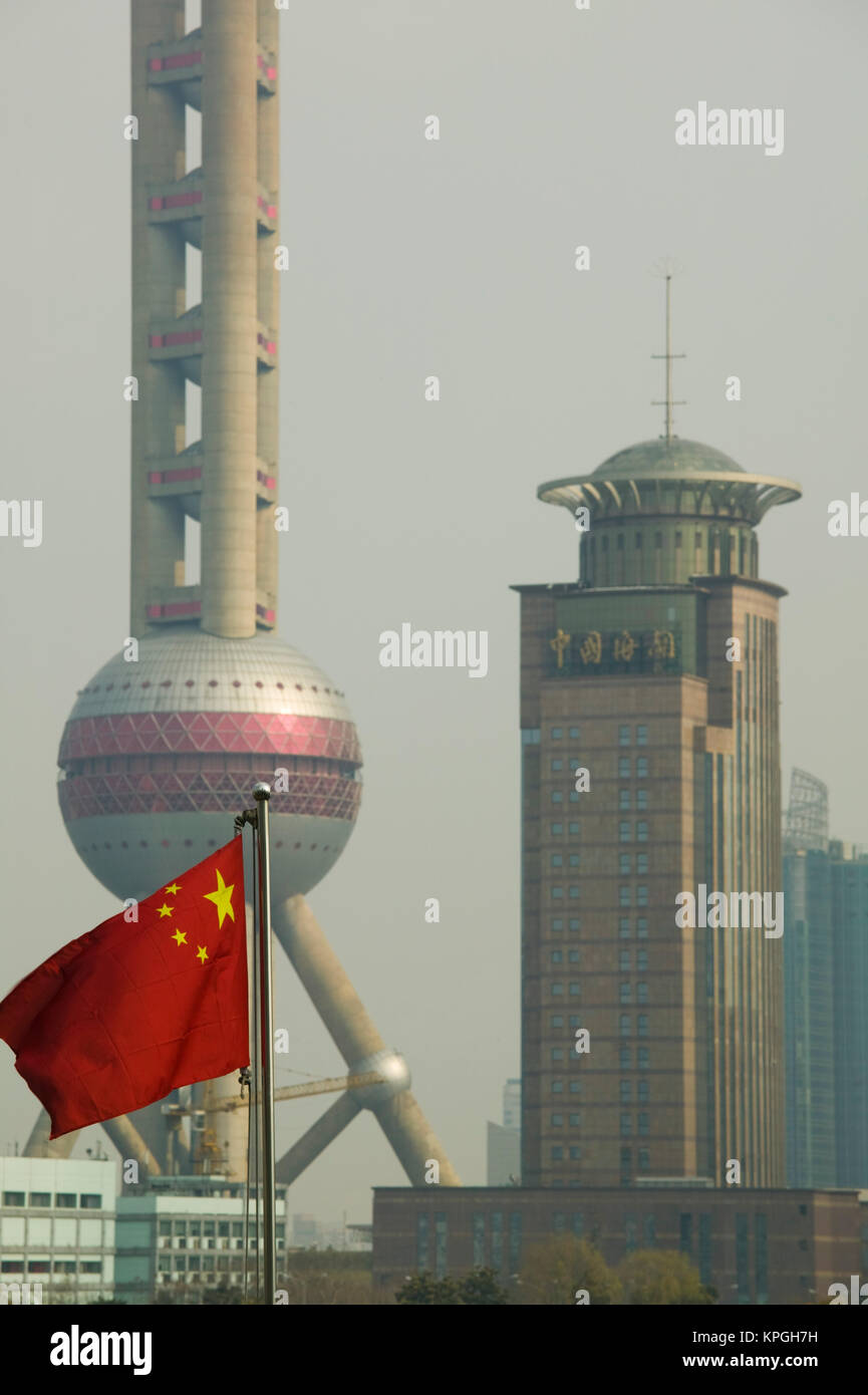 CHINA, Shanghai. Pudong District- Oriental Pearl Tower and Chinese Flag. Stock Photo