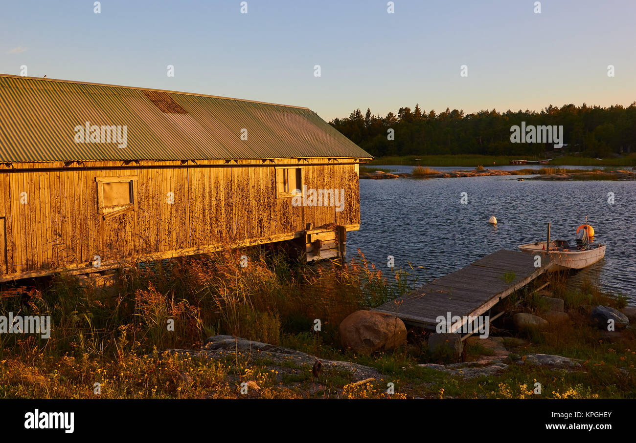 Timber cabin and wooden pier, Sweden, Scandinavia Stock Photo