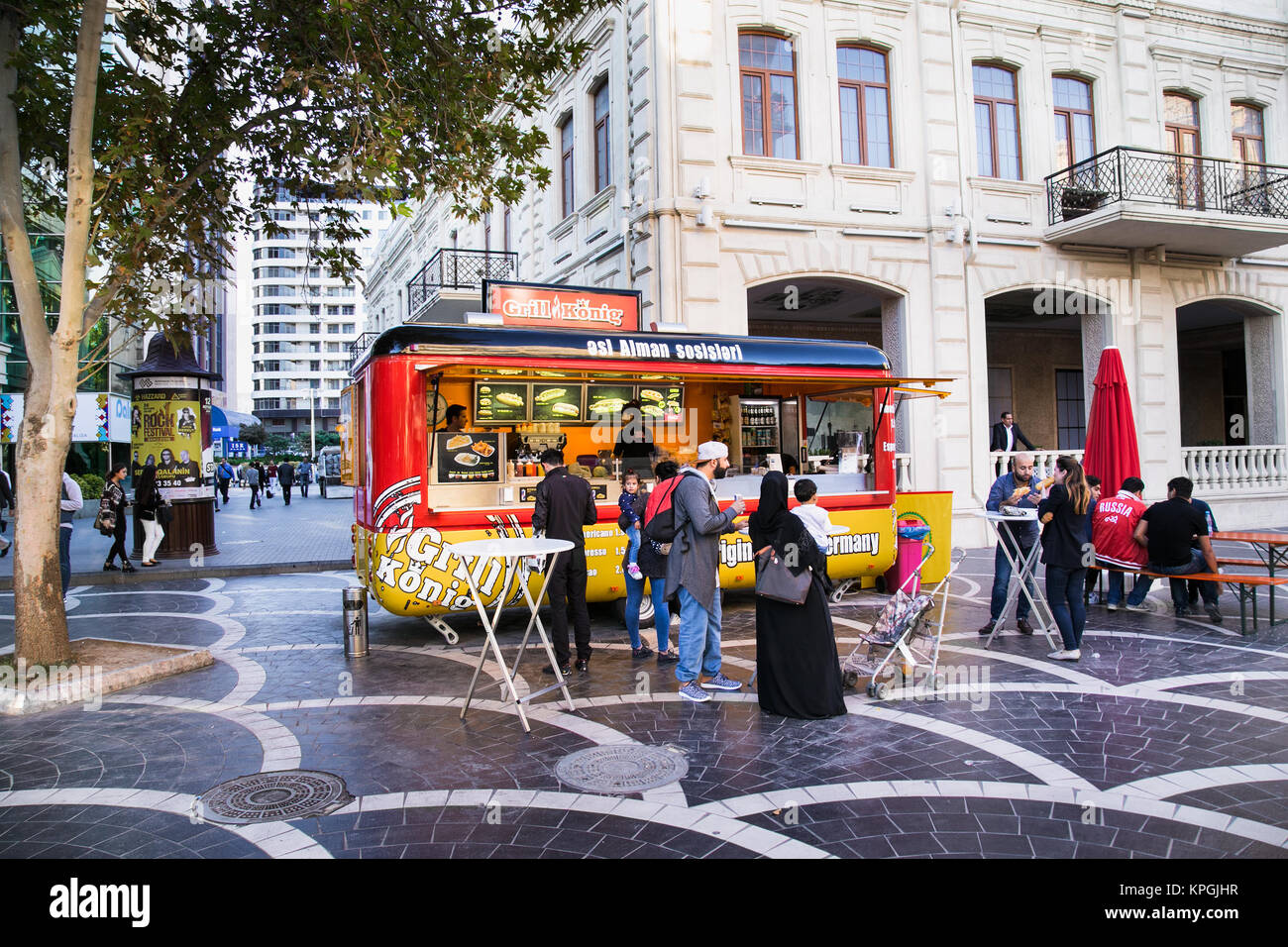 BAKU, AZERBAIJAN - OCT 3, 2016: Unrecognizable people visiting street fast food market in Baku on Oct 3, 2106, Azerbaijan. Stock Photo