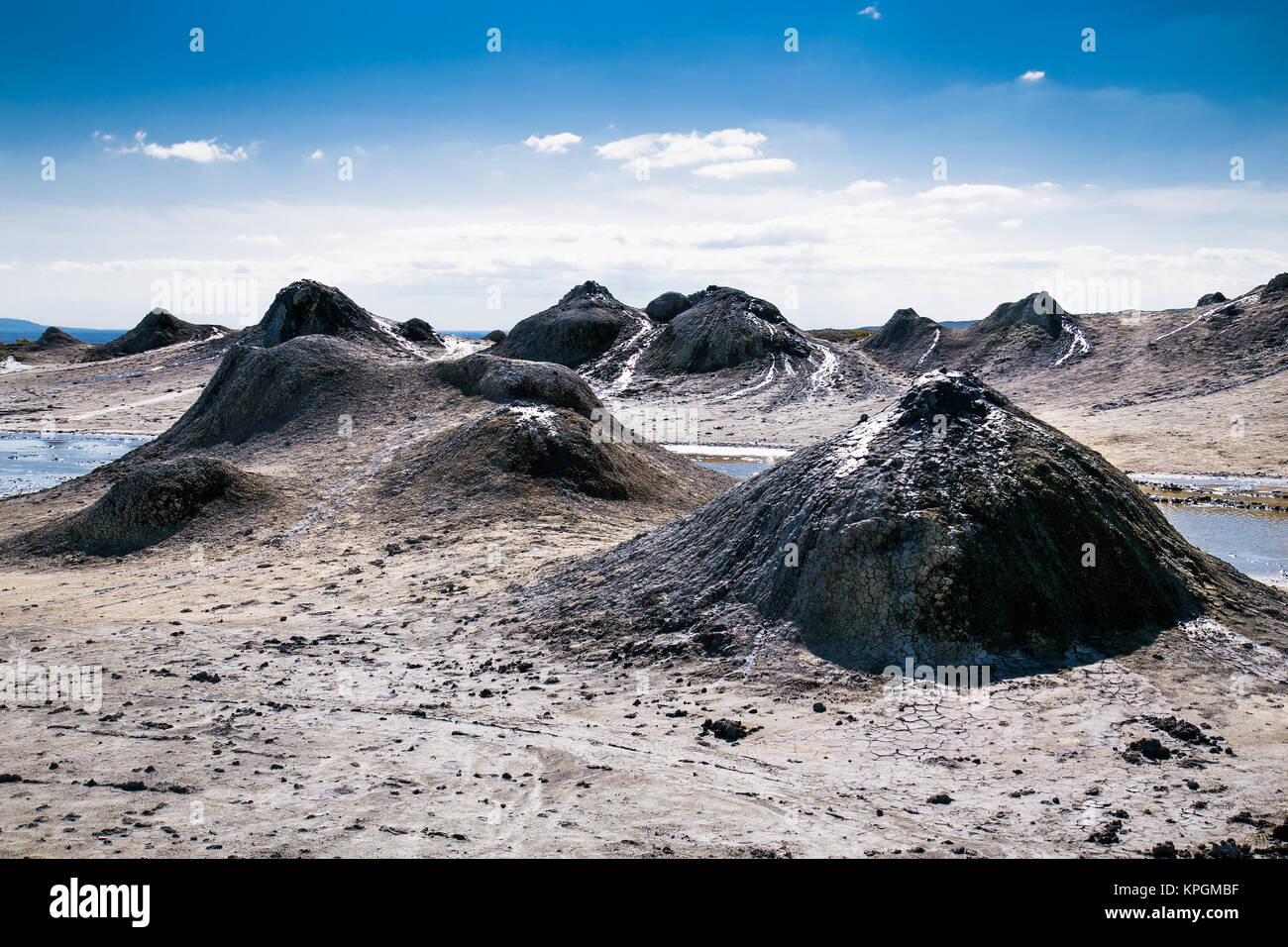 Field with craters of mud volcano in Gobustan and eruption bubbling mud