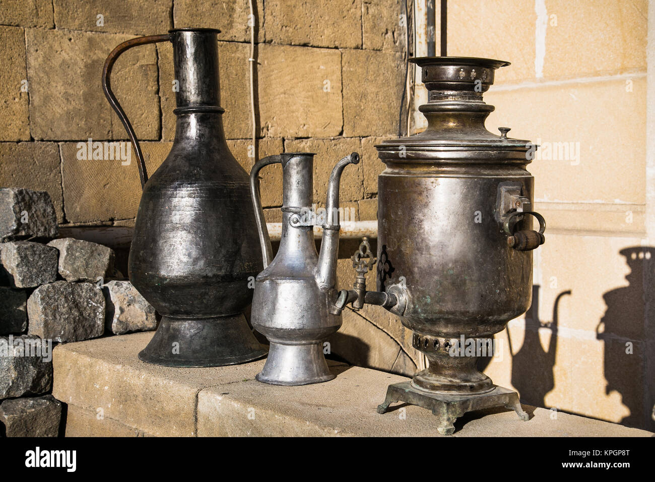 Old oriental antiques barass jungs and vases on street market in Baku, Azerbeijan. Stock Photo