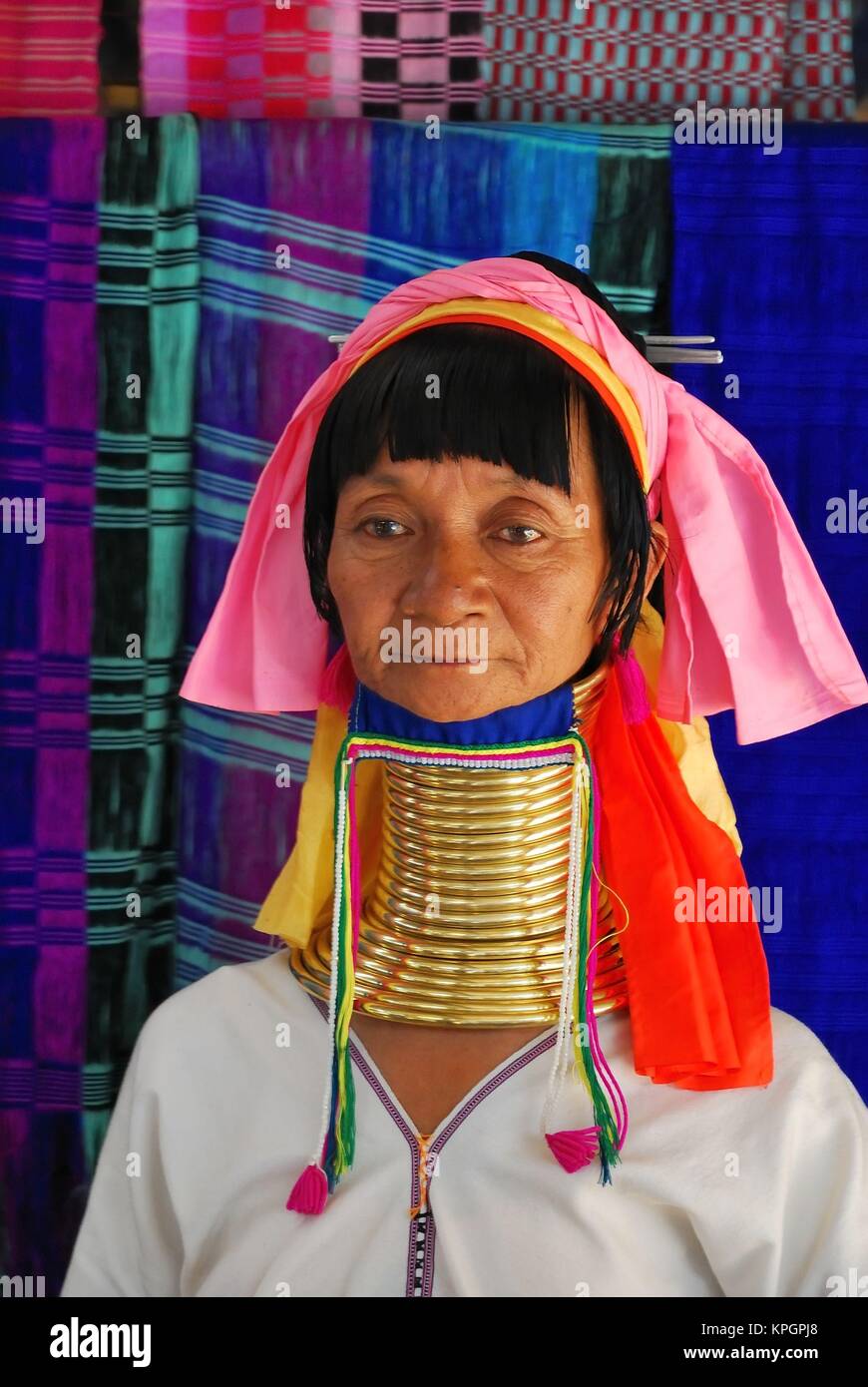 Portrait of elderly long necked Karen tribeswoman in traditional costume. Stock Photo