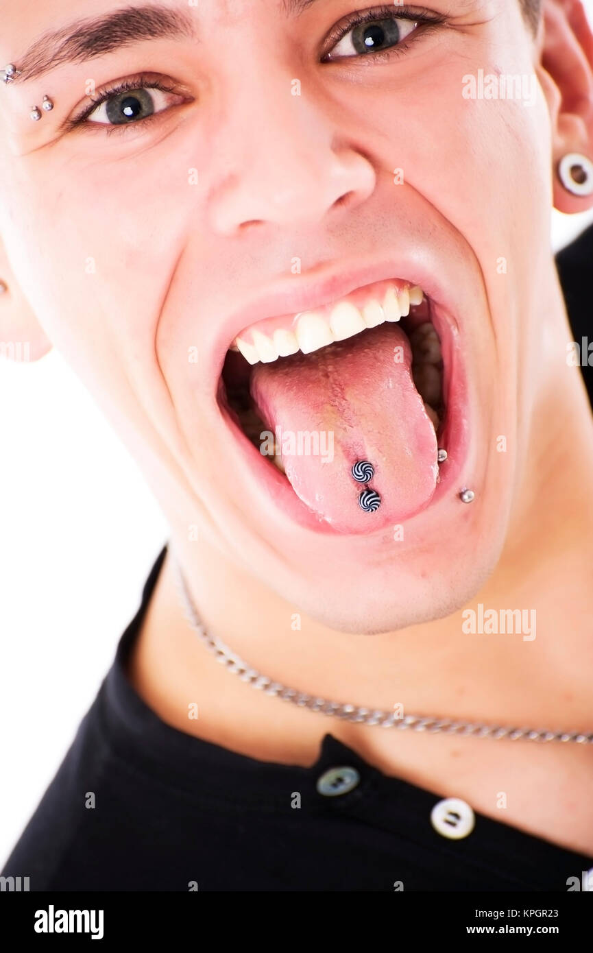 Model released , Gepiercter, junger Mann, 27, zeigt die Zunge - pierced, young man shows tongue Stock Photo