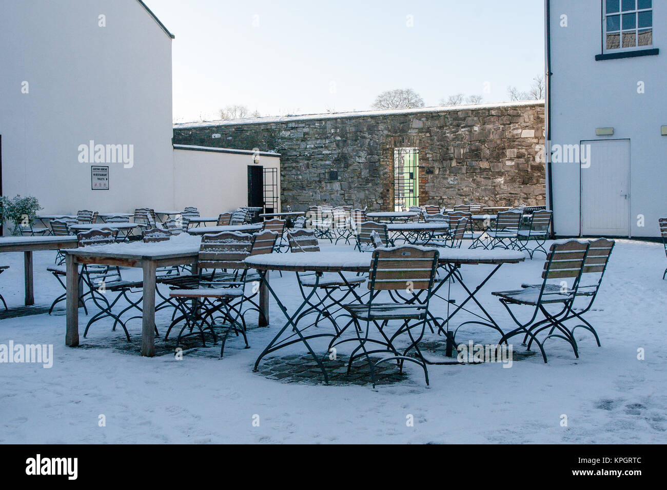 Outdoor tables of The Phoenix Café covered in snow. Phoenix Park in