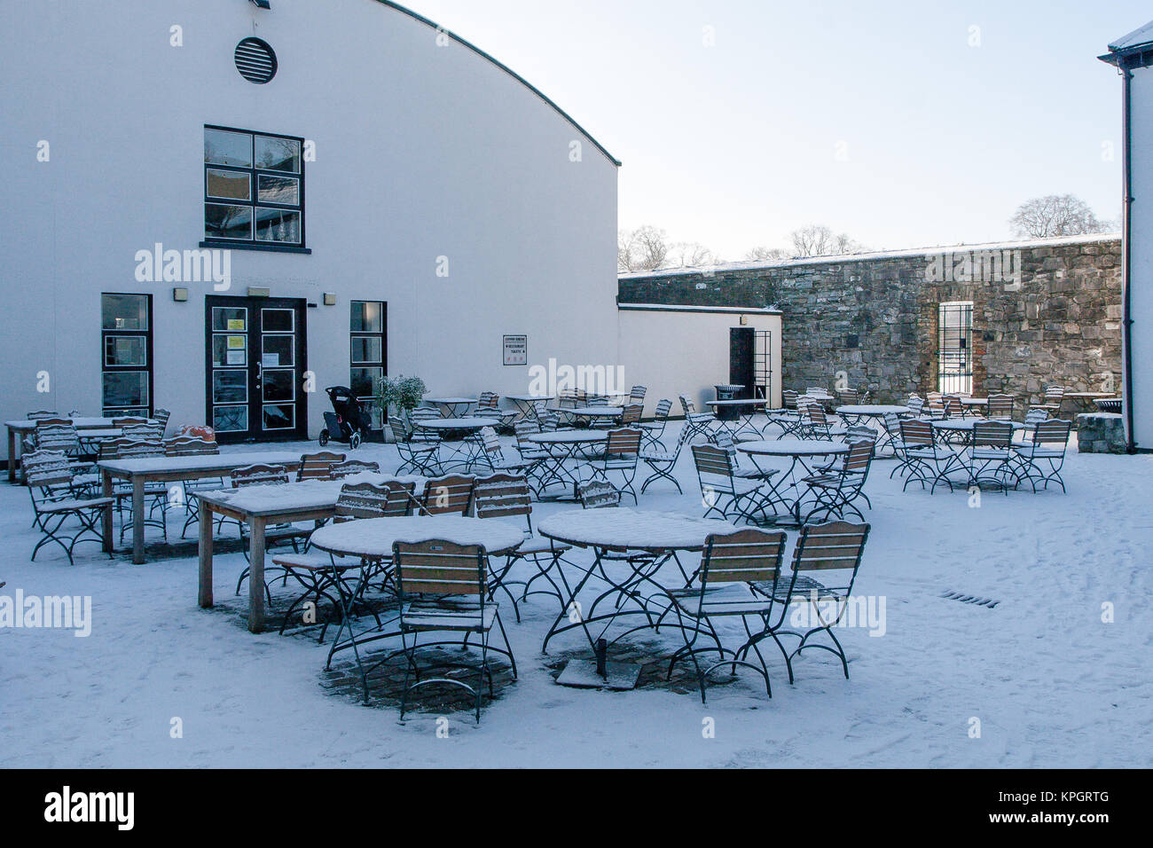 Outdoor tables of The Phoenix Café covered in snow. Phoenix Park in