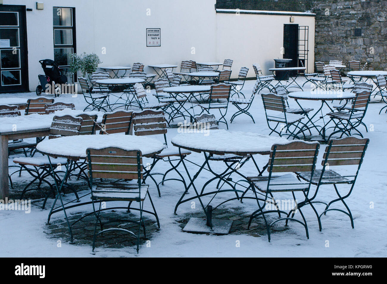 Outdoor tables of The Phoenix Café covered in snow. Phoenix Park in