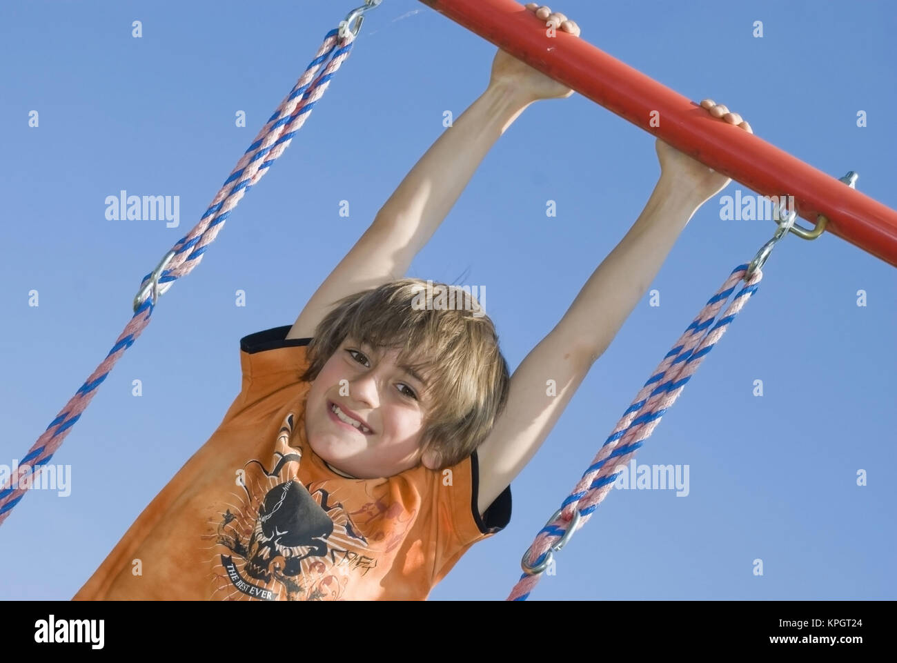 Model released , Junge, 11, spielt am Kinderspielplatz - boy at playground Stock Photo