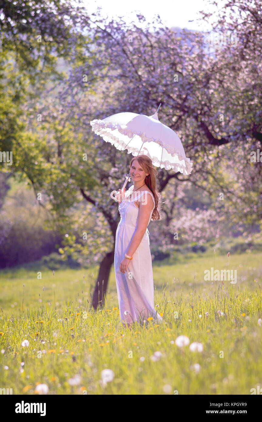 young women in cherry garden Stock Photo - Alamy