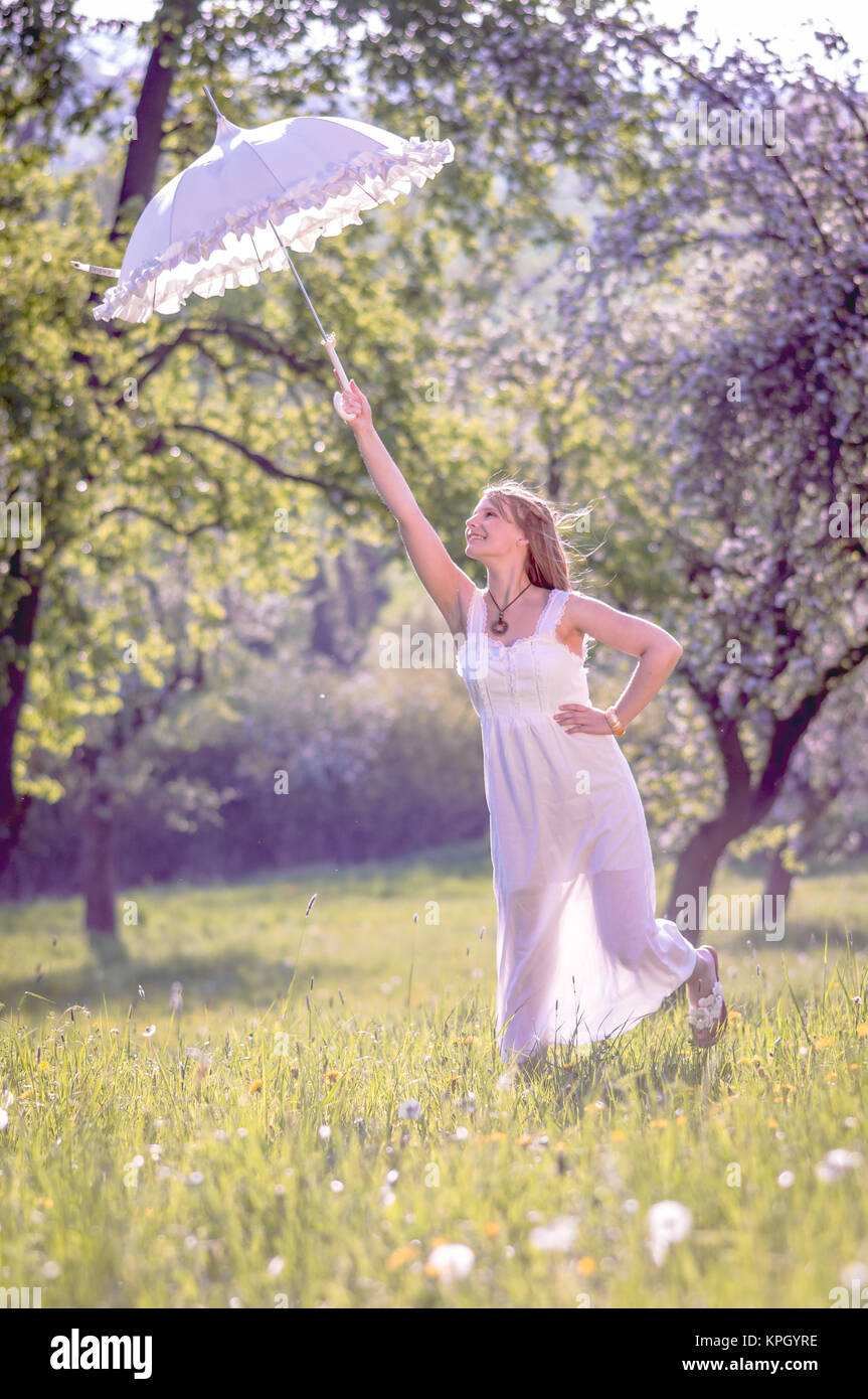 young women in cherry garden Stock Photo - Alamy