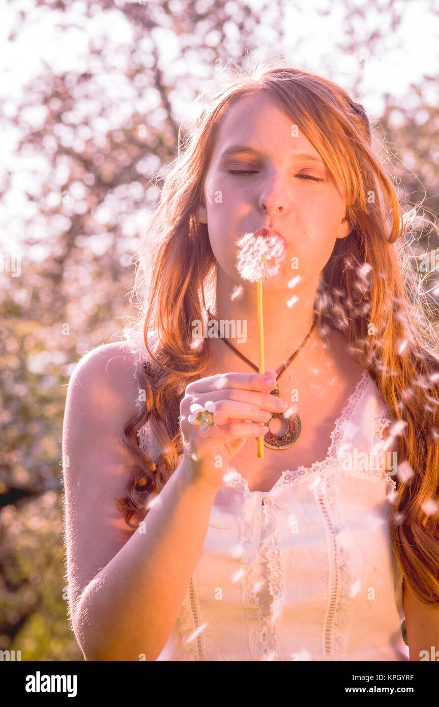 young women in cherry garden Stock Photo - Alamy