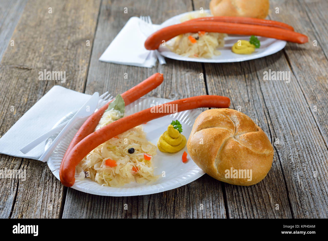 German street food Hot Debreziner sausages with sauerkraut, spicy