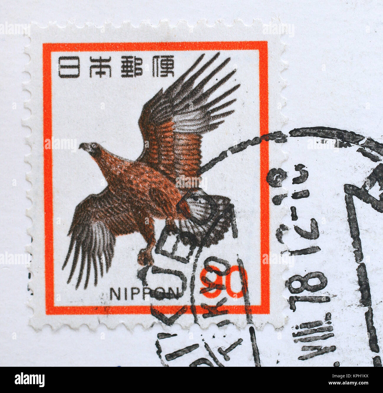 Nippon/Japanese postage stamp with Golden Eagle and ink stamp, South Africa. Stock Photo