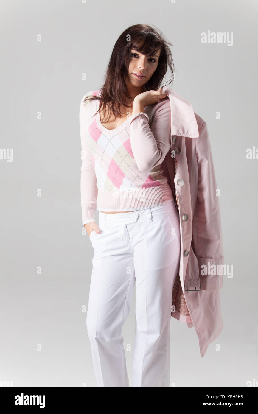 young woman in a coat on white Stock Photo - Alamy