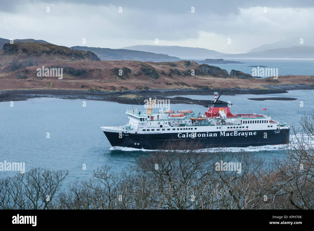 The 'Isle of Mull' Caledonian MacBrayne ferry coming in to Oban on the Firth of Lorne with hills and islands behind. Stock Photo