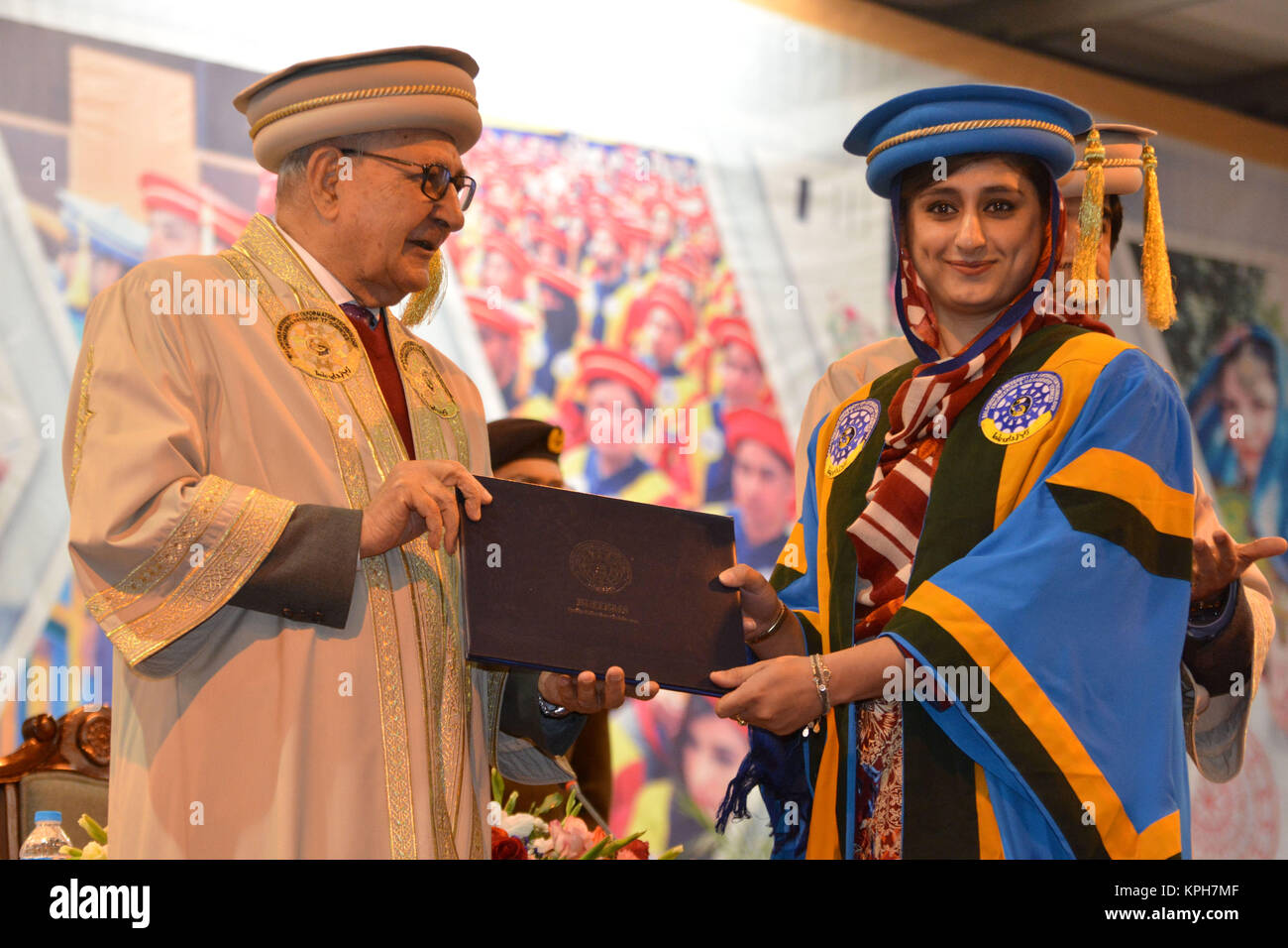 QUETTA, PAKISTAN. Dec-14 2017: Chancellor and Governor of Balochistan Mr. Muhammad Khan Achakzai awarding degree to pass out graduates during ceremony Stock Photo