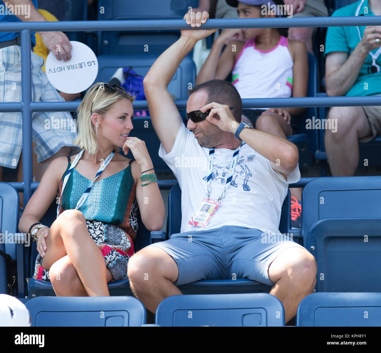 FLUSHING NY- AUGUST 27: Professional golfer from Spain Sergio Garcia with German girlfriend Katharina Boehm who was spotted wearing what appears to be a engagement ring on Arthur Ashe stadium On Day Three of the 2014 US Open at the USTA Billie Jean King National Tennis Center on August 27, 2014 in the Flushing neighborhood of the Queens borough of New York City.   People:  Sergio Garcia, Katharina Boehm Stock Photo