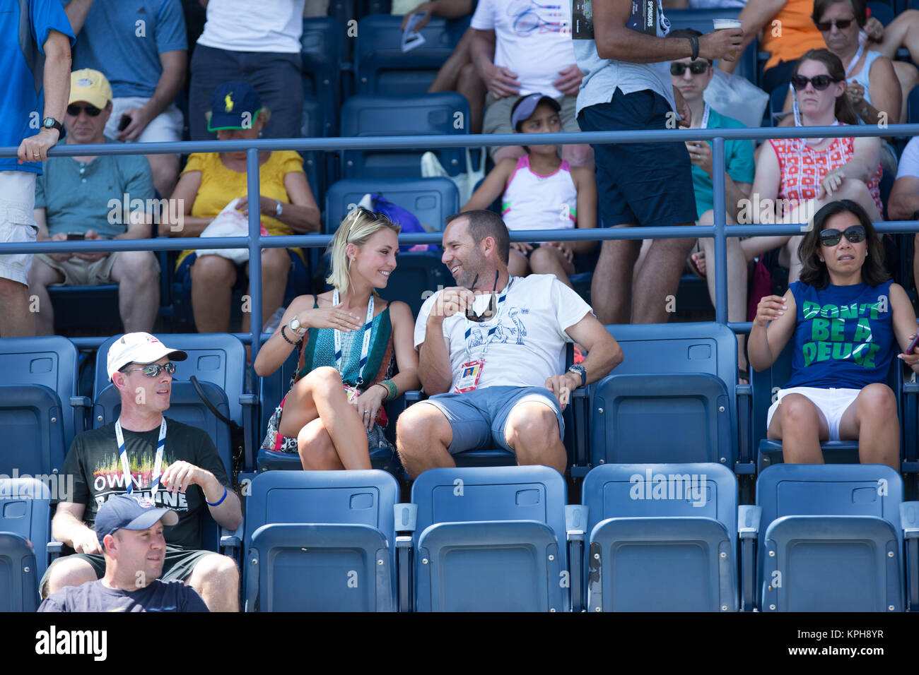 FLUSHING NY- AUGUST 27: Professional golfer from Spain Sergio Garcia with German girlfriend Katharina Boehm who was spotted wearing what appears to be a engagement ring on Arthur Ashe stadium On Day Three of the 2014 US Open at the USTA Billie Jean King National Tennis Center on August 27, 2014 in the Flushing neighborhood of the Queens borough of New York City.   People:  Sergio Garcia, Katharina Boehm Stock Photo