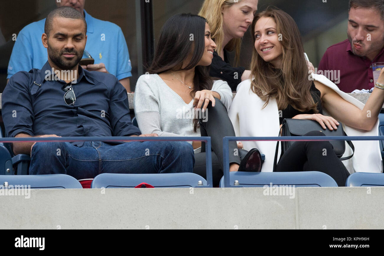 FLUSHING NY- SEPTEMBER 08: Tony Parker, Axelle Francine, Andrea Rajacic, at the Mens Singles Finals Day fifteen of the 2014 US Open at the USTA Billie Jean King National Tennis Center on September 8, 2014 in the Flushing neighborhood of the Queens borough of New York City   People:  Tony Parker, Axelle Francine, Andrea Rajacic Stock Photo