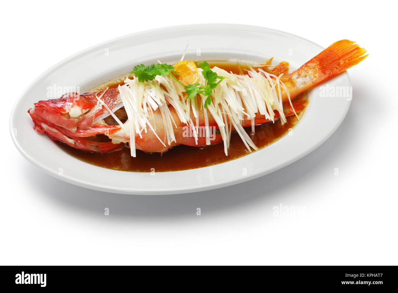 chinese steamed red grouper with ginger, scallions and soy sauce Stock Photo