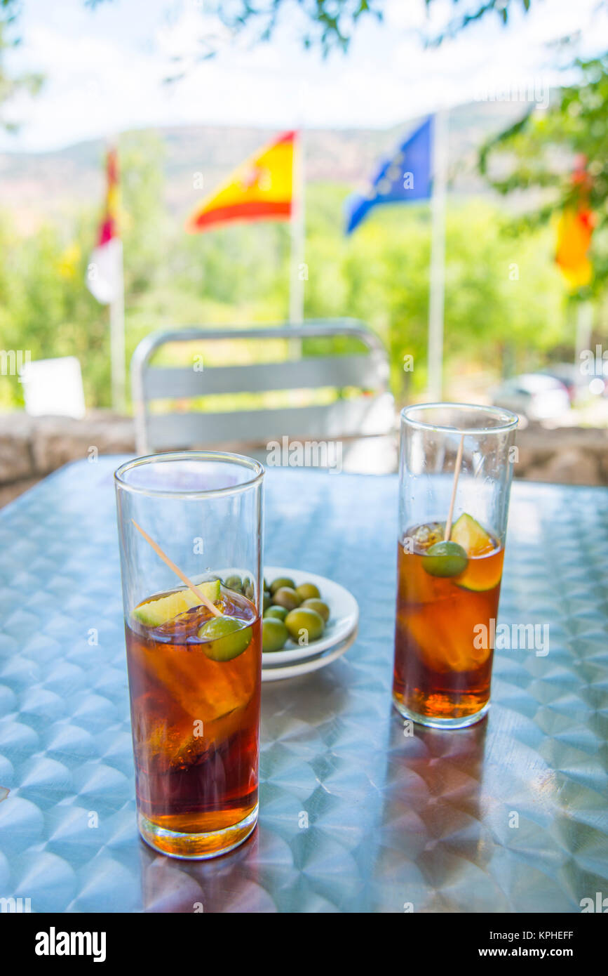 Two glasses of vermouth with green olives in a terrace. Spain. Stock Photo