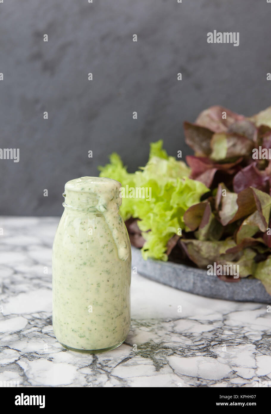 yogurt dressing with fresh salad Stock Photo