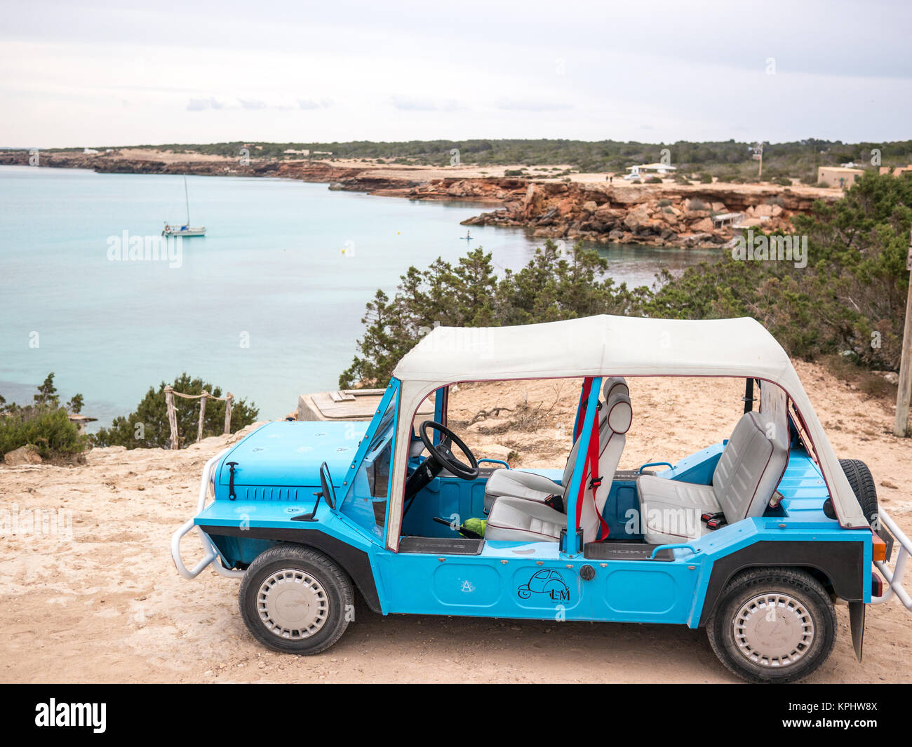 FORMENTERA, SPAIN - MAY 24, 2015: An Austin Mini Moke on the Cala Saone surroundings. Stock Photo